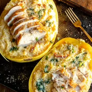 chicken spaghetti squash on a baking sheet with parsley