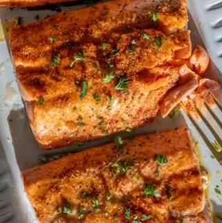broiled salmon recipe being flaked with a fork