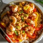 cashew shrimp in a bowl over rice
