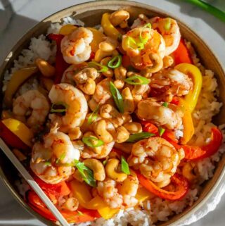 cashew shrimp in a bowl over rice
