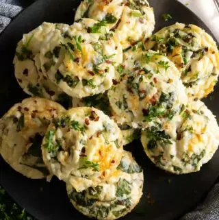 egg white bites recipe on a plate with parsley on top