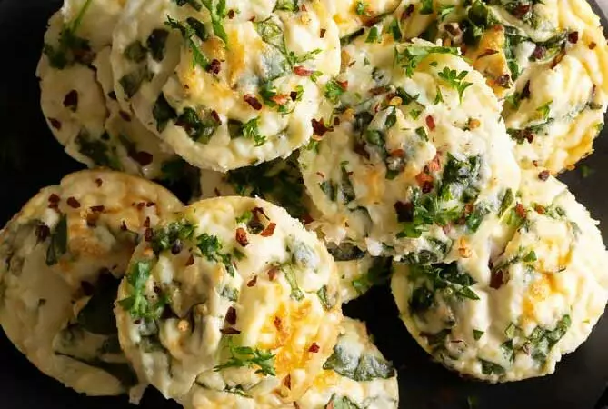 egg white bites recipe on a plate with parsley on top