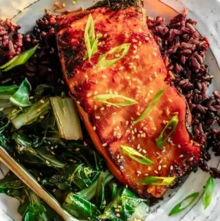 miso glazed salmon on a plate with rice and bok choy