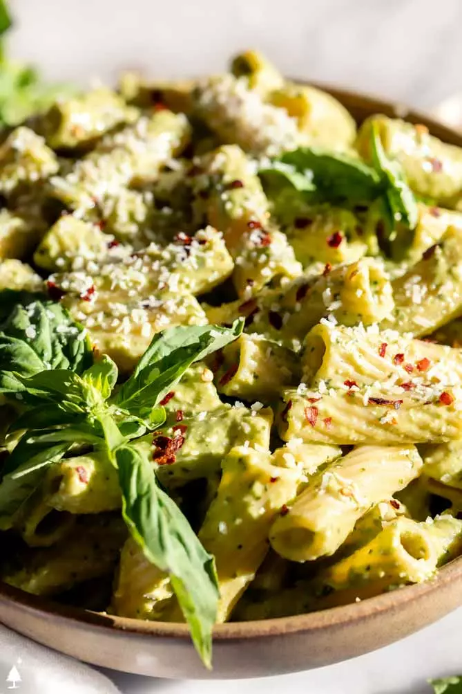 broccoli pesto recipe with basil on top of pasta