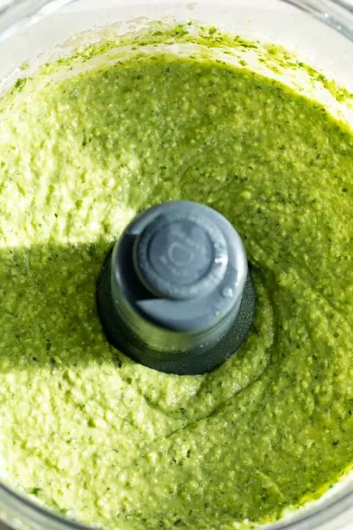 broccoli pesto recipe in a food processor after everything has combined