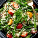 asparagus salad recipe in a bowl with a fork