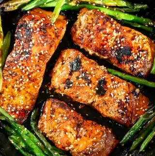 honey glazed salmon recipe in a pan with green beans
