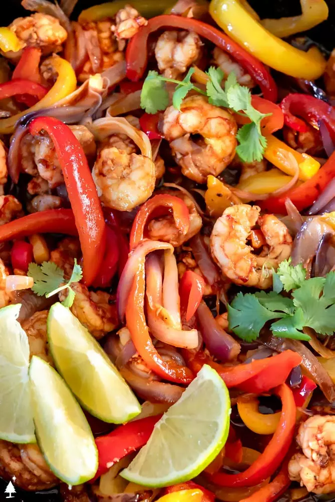 shrimp fajitas recipe with veggies in a pan